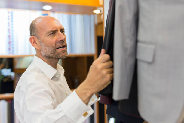 istock Business Man Selecting Fabric For a Custom Tailored Suit 680865754
