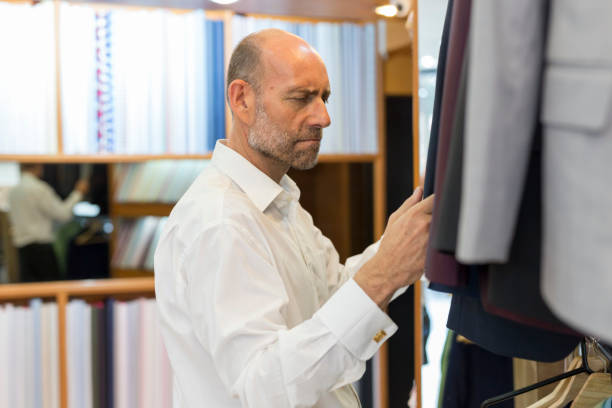 istock Business Man Selecting Fabric For a Custom Tailored Suit 680865758