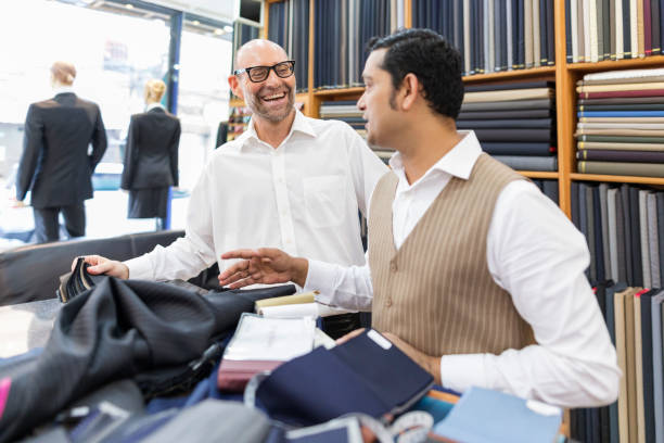istock Business Man Selecting Fabric For a Custom Tailored Suit 680865820