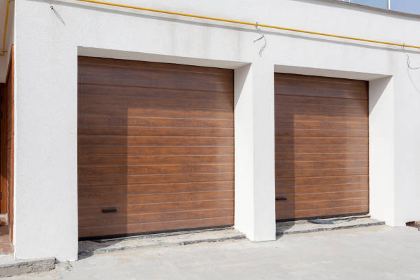 istock Double brown garage door in a new house 680865954