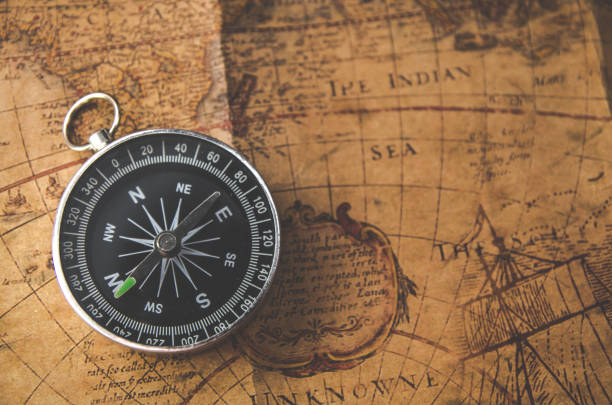 istock Old vintage retro golden compass on ancient map 680866214