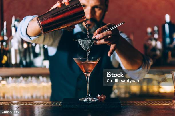 Barman Is Making Cocktail At Night Club Stock Photo - Download Image Now - Bartender, Cocktail, Bar - Drink Establishment