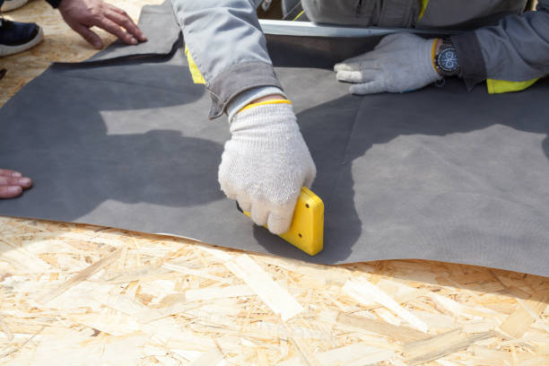 istock Installing Skylights in new home. Construction mason worker attach insulation material on Oriented Strand Board 680866570
