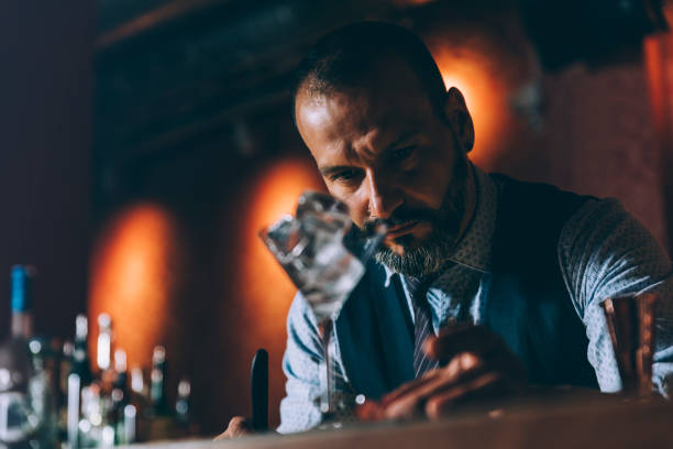 istock Barman is making cocktail at night club. 680866642