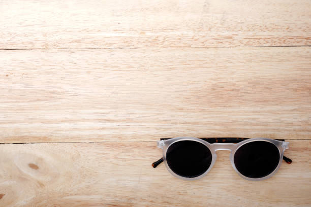 istock Glasses on wooden background 680867034