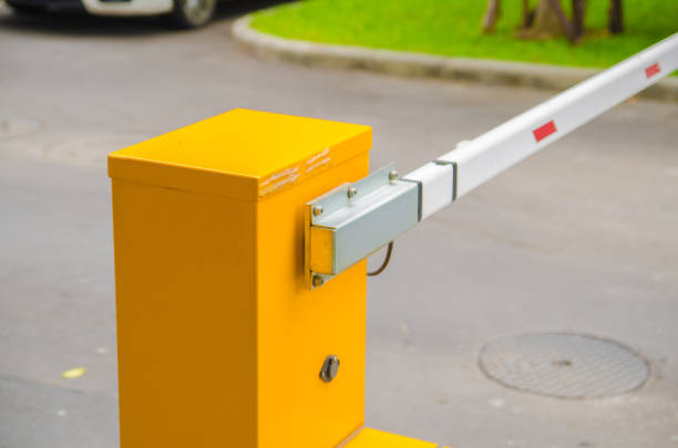 istock Security system for building access - barrier gate stop with toll booth, traffic cones and cctv 680874606