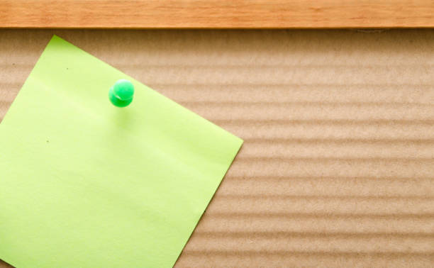 istock blank reminder note nailed to a wooden plank or wall 680874620