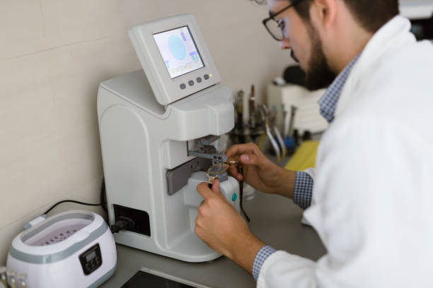 istock Optician repairing and fixing eye glasses 680875108