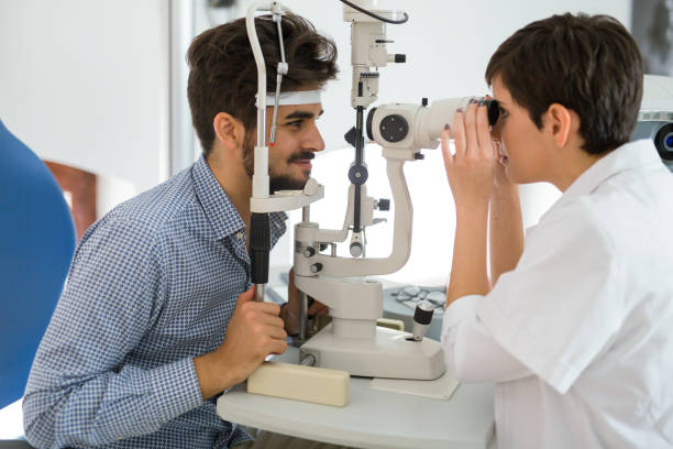 istock Patient or customer at slit lamp at optometrist or optician 680875160