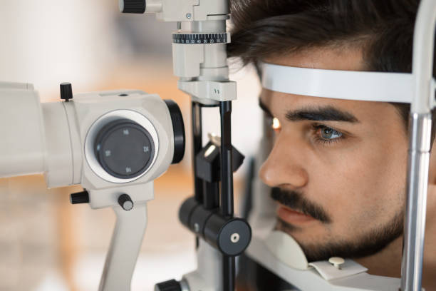 istock Patient or customer at slit lamp at optometrist or optician 680875340