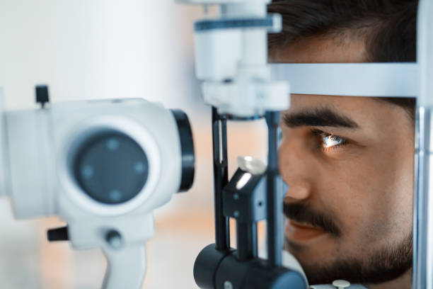 istock Patient or customer at slit lamp at optometrist or optician 680875426
