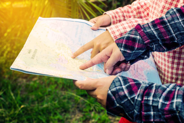 istock view of a young planning a journey looking at a map 680882098