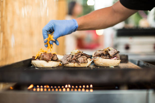 istock Chef cooking burgers 680882206