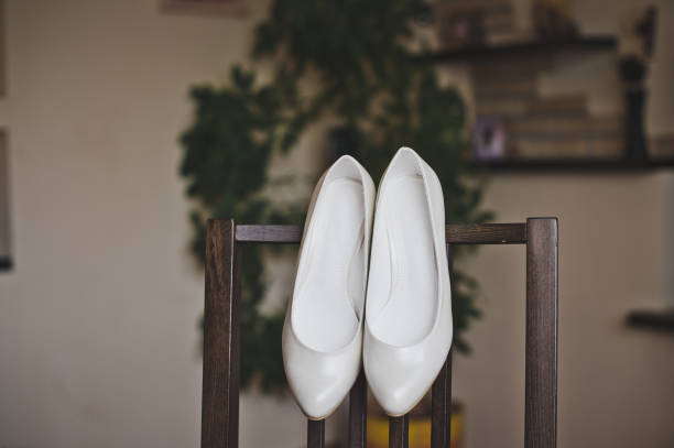 istock Beautiful white shoes on a chair 5194 680886844