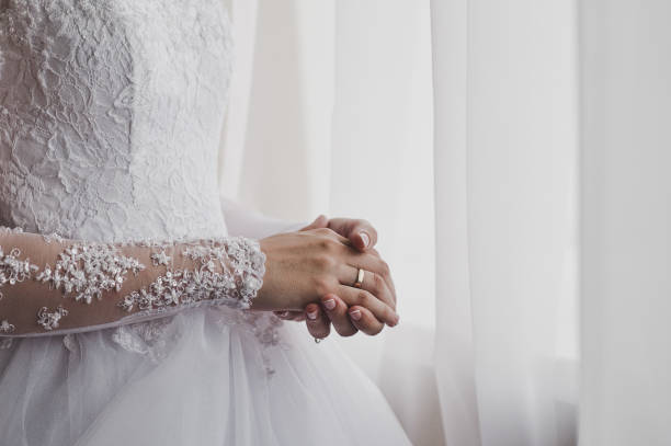 istock The brides hands clenched with excitement 5161. 680896954