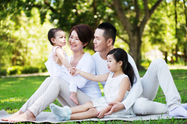 istock Happy Asian Family at the Park 680897342