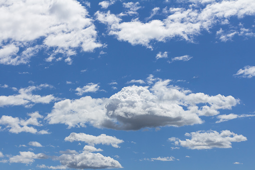 Blue spring sky with cumuliform clouds