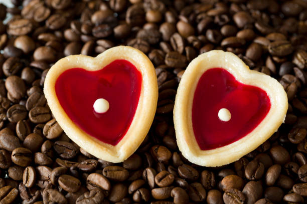 istock two sweet hearts and coffe beans 680902128