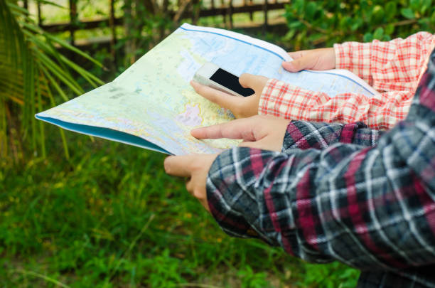istock view of a young planning a journey looking at a map 680903282