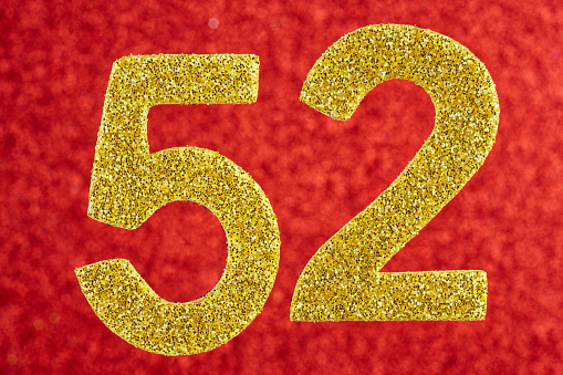 Number fifty-two yellow over a red background. Anniversary. Horizontal