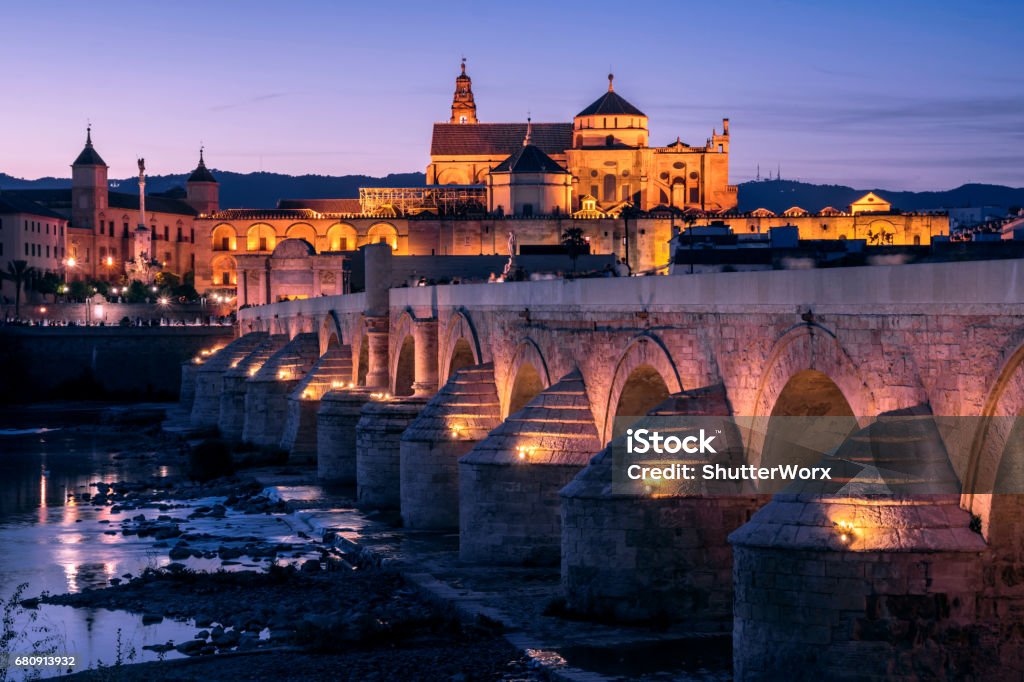 Public Bridge On The River At Dusk With Mosque In The Background In Cordoba Andalusia Spain Bridge With Reflections In Water Cordoba Mosque Stock Photo