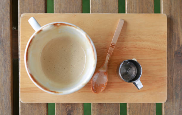 istock Empty cup of coffee on wooden table. 680916240