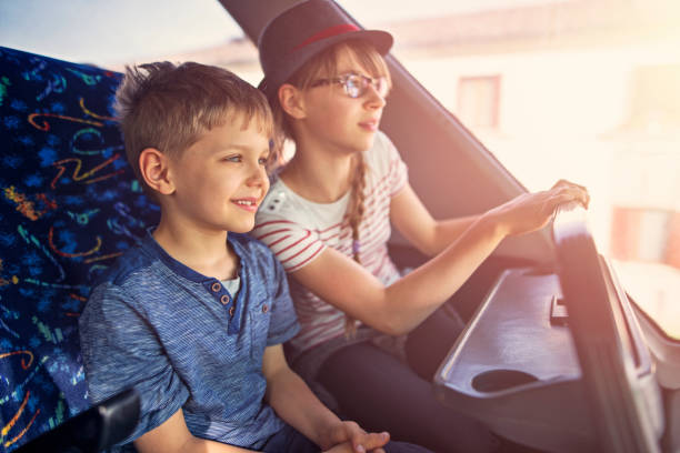 istock Brother and sister travelling by bus 680917336