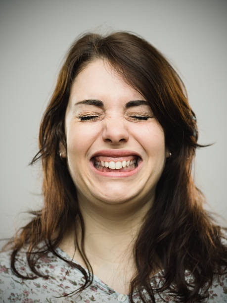 istock Close up of angry woman clenching teeth 680939984