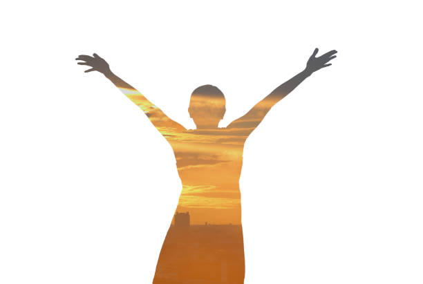 Double exposure woman feeling free and arms wide open with evening sunset on white background