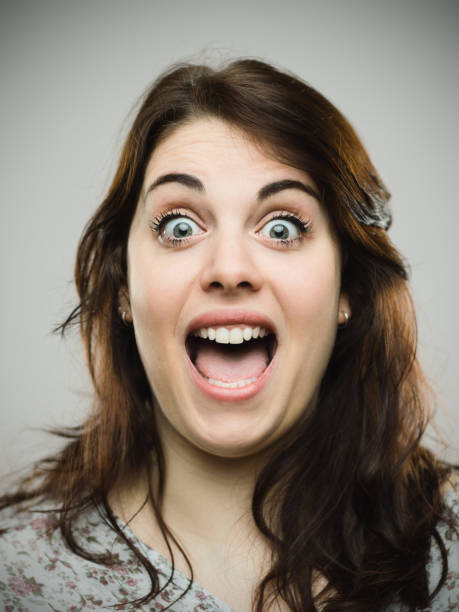 istock Excited young woman with mouth open 680941044