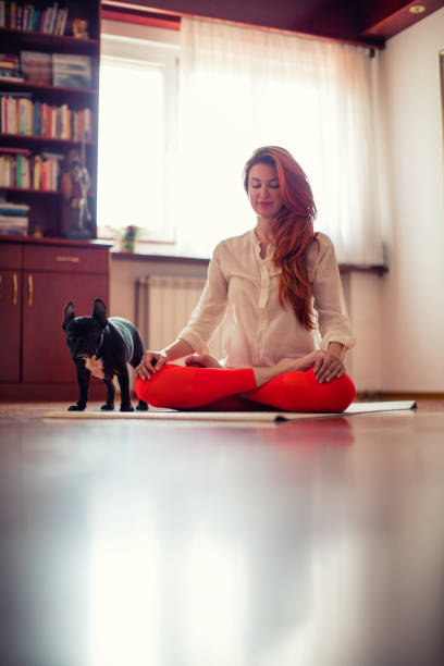istock Woman doing yoga at home 680945698