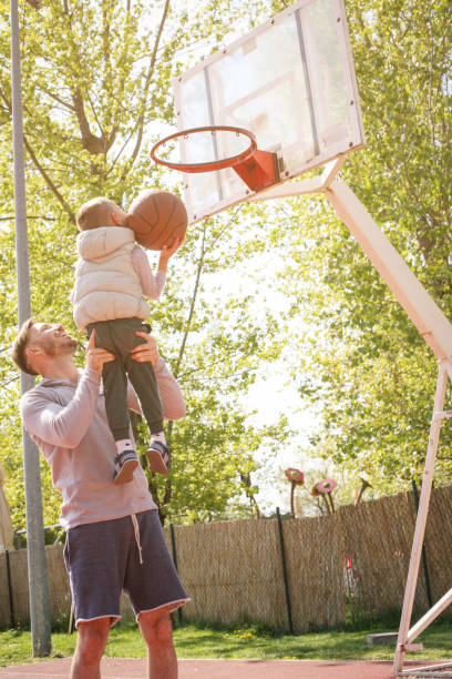 istock Father and son playing basketball. 680946138
