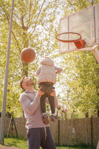 istock Father and son playing basketball. 680946818