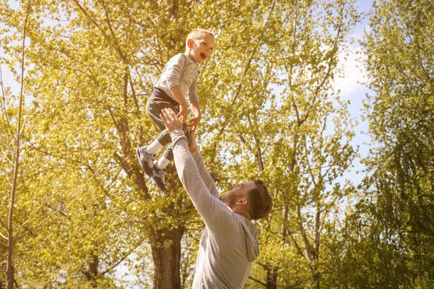 istock Father and son playing on the meadow. 680948734