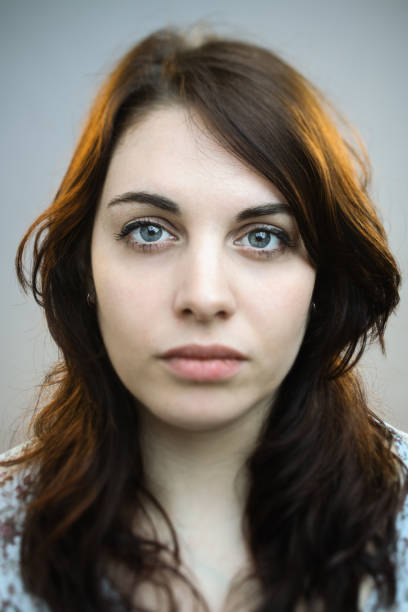 istock Beautiful young woman staring at camera 680953638