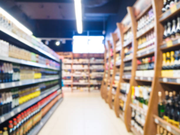 istock blur of supermarket aisle with alcohol bottles 680955596