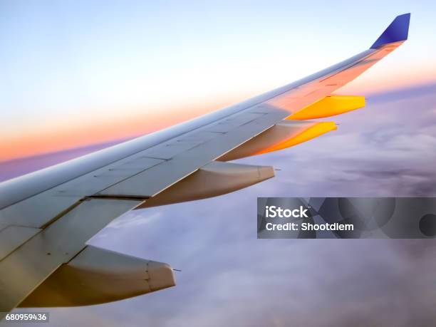 Morning Sunrise With Wing Of An Airplane Traveling Concept Stock Photo - Download Image Now