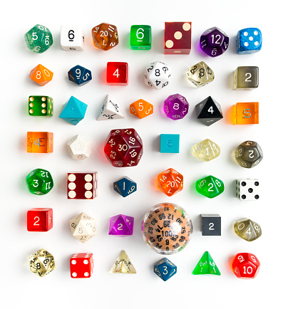 Large variety of various types of dies for gaming and chance in knelling arrangement