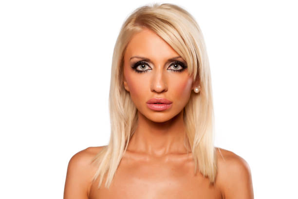 Serious young blonde on a white background