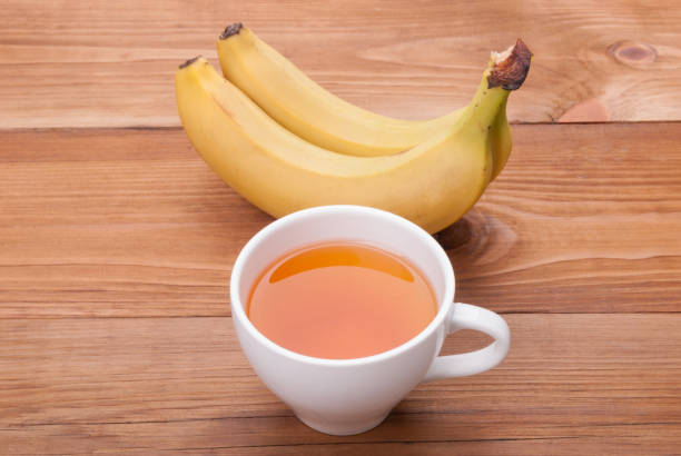 istock Cup of tea and bananas . 680993898