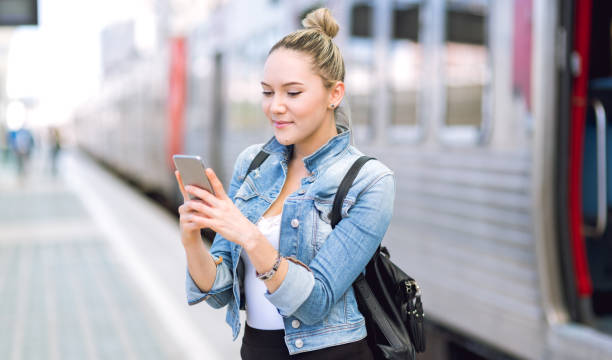 istock Beautiful young woman in real life using smartphone 680996024