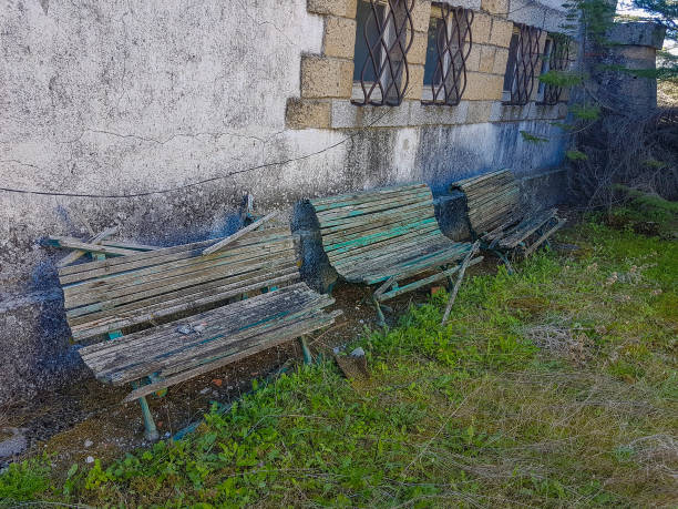 istock Old and broken wooden garden benches 681006676
