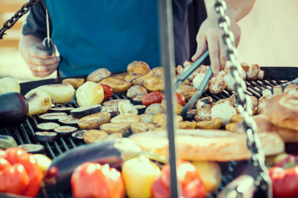 istock Man cooking on barbecue for family dinner 681007210