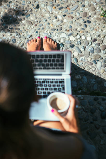 istock Woman works with laptop and coffee 681020486