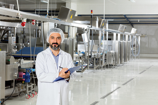 Man working at a food factory.