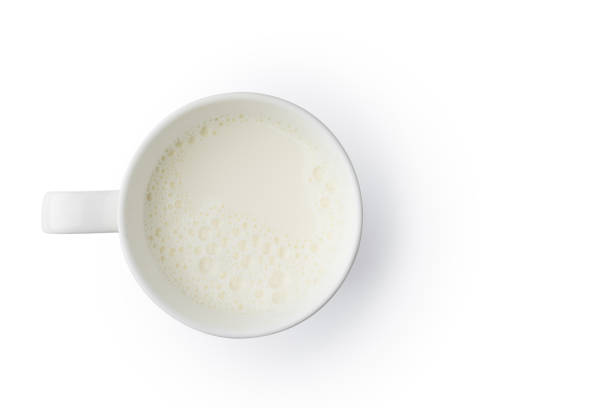 Cup with milk bubble foam top view on white background Cup with milk bubble foam on top view isolated texture on white background object design CUP OF MILK stock pictures, royalty-free photos & images