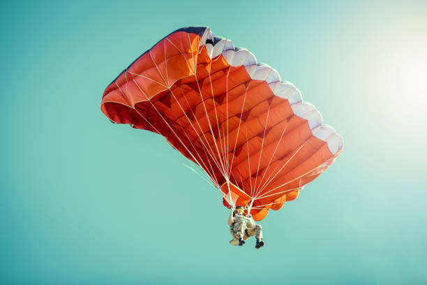 istock Skydiver On Colorful Parachute In Sunny Clear Sky. 681042318