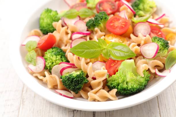 istock pasta salad with tomato and broccoli 681057974
