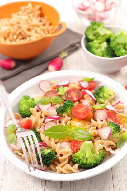 istock pasta salad with tomato and broccoli 681058004