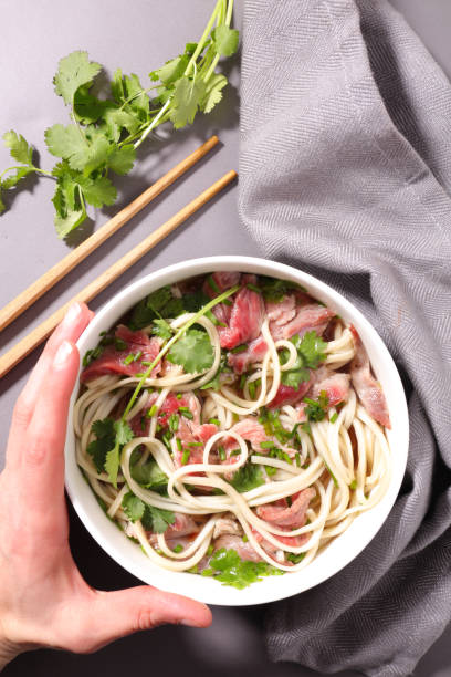 istock chinese noodle and beef soup 681058612